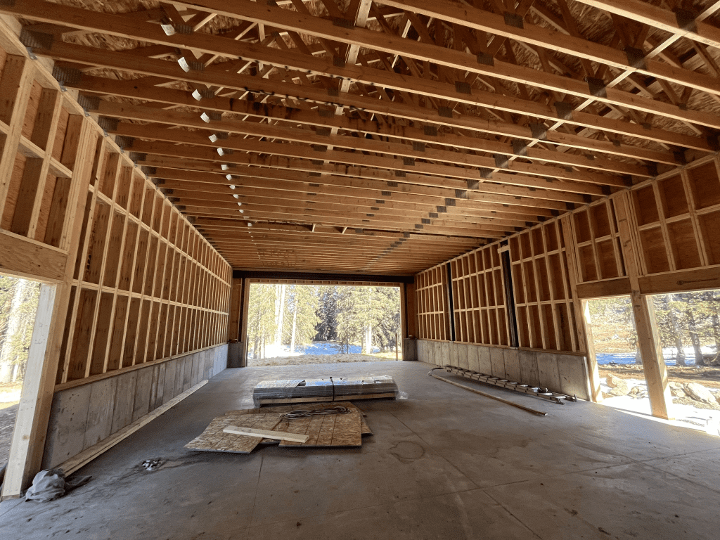 A Construction site with framed boards over a cement floor for the Skyway Station