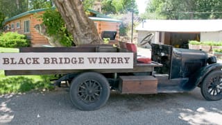 Antique Farm Truck with a hand letter Black Bridge Winery Sign