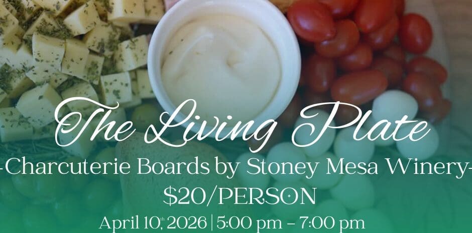 A promotional graphic for "The Living Plate," a charcuterie board cooking class by Stoney Mesa Winery. Visual Composition: Background: A top-down close-up of a vibrant charcuterie board featuring cubed cheeses topped with herbs, diced meats, toasted bread slices, cherry tomatoes, and small white mozzarella balls. A small white bowl of dip sits in the center. Text Overlays: Large elegant white script at the center reads "The Living Plate". Below this, green and white text lists the event as a cooking class at Bill Heddles Recreation Center on April 10th, 2026, with a cost of $20 per person and a registration deadline of April 8th. Logos: The City of Delta and Delta Recreation logos are featured at the bottom center.